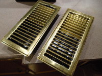 pair of air vent register, metal, golden colored