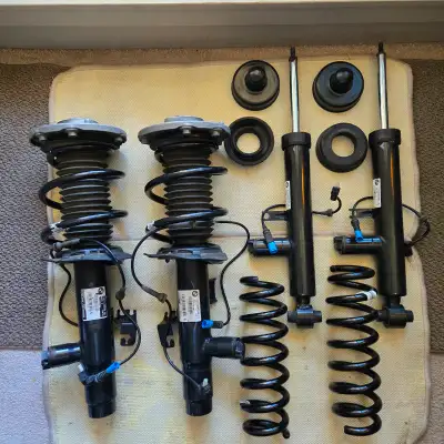BMW ORIGINAL EQUIPMENT, electronically adjustable struts & shocks. Includes strut mounts, springs an...