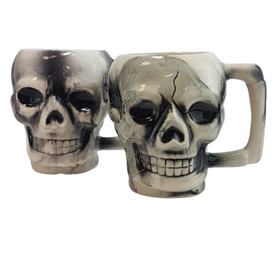Set of 2 Skull Mugs White, black; 3 dimensional design Each measures approximately 4.5 inches tall x...