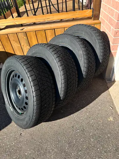 BRIDGESTONE BLIZZAK DM-V2 WINTER TIRES ON STEEL RIMS — FULL SET, LIKE-NEW CONDITION $800 for the com...