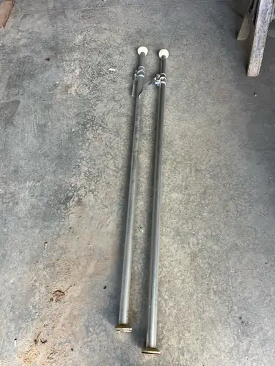 Two brand new never used cargo load bars for hauling freight