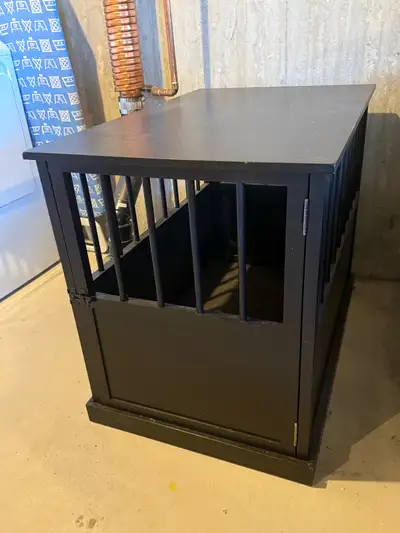 This never used single door dark wood dog crate is in good condition (a couple scratches on top) and...