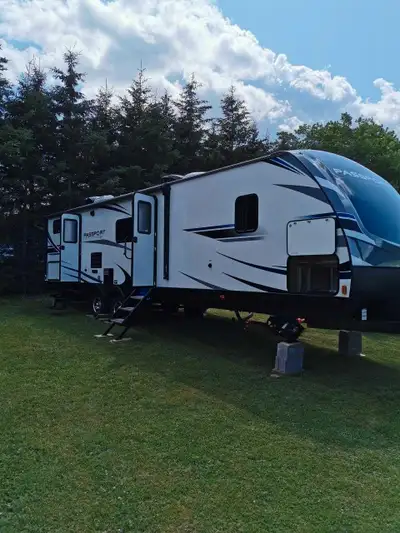 Used 2019 Passport 3351BH trailer in good condition. Sleeps 10 ppl