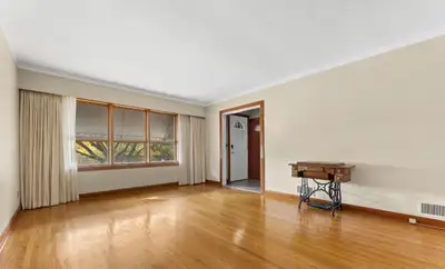 Charming mid-century brick bungalow with hardwood floors, spacious kitchen, and private backyard. Th...