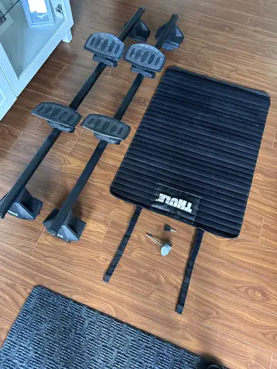 Elite Model Thule Roof Rack for Mazda 3 four door. Length is 53 1/2 inches with some adjustability....