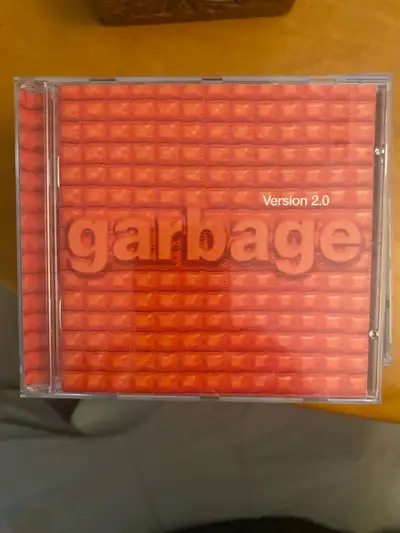Selling a used Garbage Version 2.0 CD, featuring hit tracks from the iconic alternative rock band. T...
