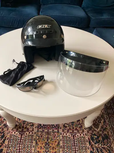 Motorcycle helmet size small - includes new face shield, visor and wind resistant sunglasses.