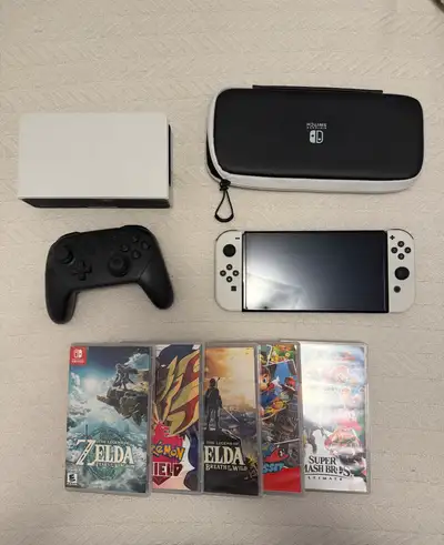 Nintendo Switch OLED, 5 games, carrying case, and Pro Controller. All near brand new condition, no d...