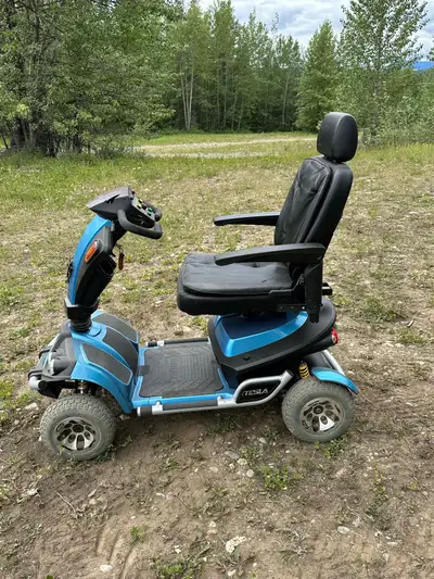 2014 Tesla mobility scooter with full suspension for sale. C/W charger and new batteries. Over all g...