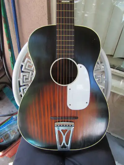 This refurbished vintage guitar has great sound, looks beautiful and comes with an old case and a me...