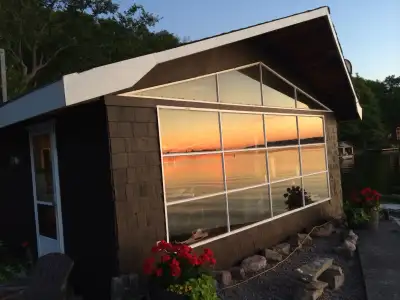 Seasonal waterfront cottage - chalet for rent . Six months with optional longer availability, April...