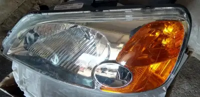 Looking NEW, very clear polycarbonate (replaces yellowed headlight) NO BLUBS, no sockets, your exist...