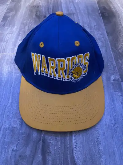 Score a piece of basketball history with this vintage Golden State Warriors snapback hat! The iconic...