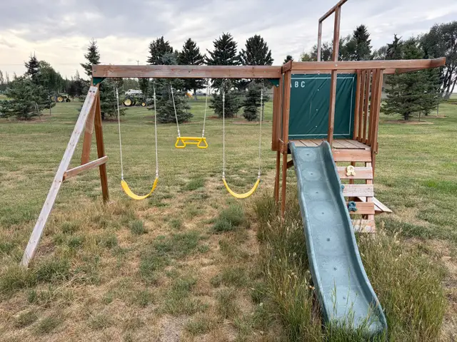 Child’s swing set and slide 