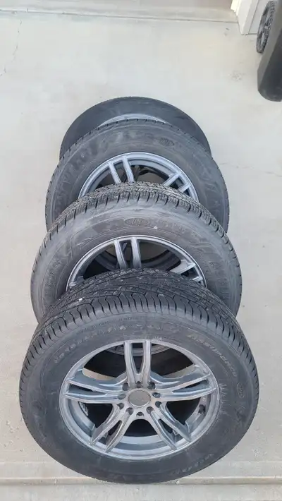 Up for sale are a set of four All-Season Goodyear Assurance tires sized at 225/60R16, on Envy Wheels...