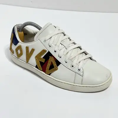 Step out in style with these Gucci Ace Loved sneakers! These stylish sneakers feature a classic whit...
