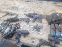 Bin of paintball guns and accessories