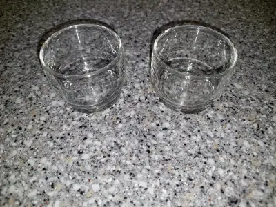 Here are two Swissair Airlines juice glasses, these measure about 2.5” wide and 2” tall. The logo is...