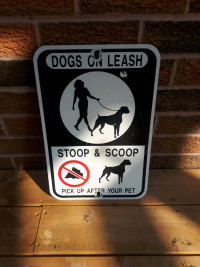 Vintsge dogs on leash stoop & scoop metal road signs 