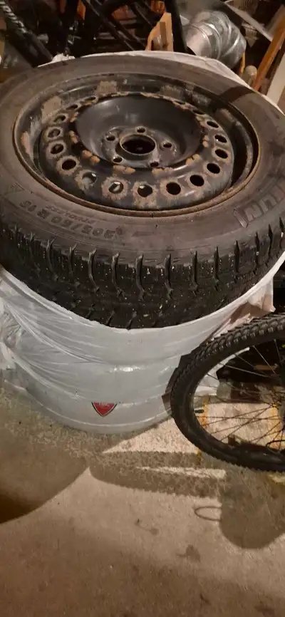 4 Michelin X ICE winter Tires and rims. 295/60 R 15 Very good condition