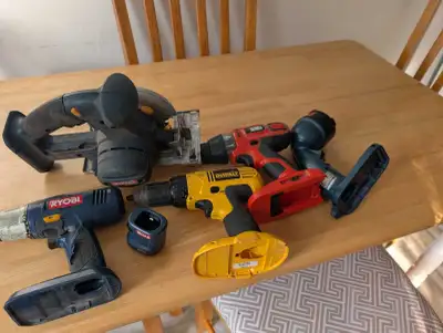 This lot features a variety of pre-owned power tools, including a circular saw, several drills, and...