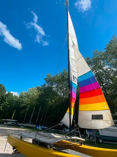 THIS 16 FOOT HOBIE CAT SAILBOAT IS IN GOOD CONDITION AND READY TO SAIL ! IT’S ON A GOOD TRAILER WITH...