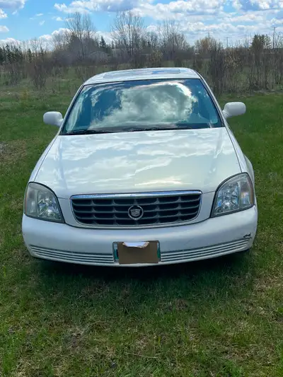 04 Deville only 260,000 km on Northstar 4.6 L V8 engine has the moonroof and original chrome rims. F...