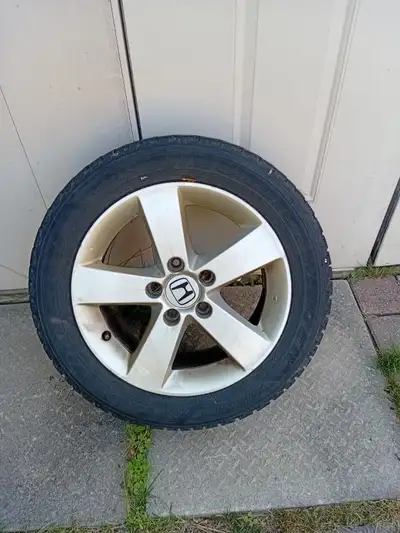 Four sale oem civic rims with tires good for maybe one more season . rims are straight and not bent...