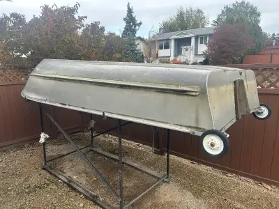 14 foot aluminum boat with 9.9 Johnson outboard motor. Comes with oars, fishing net, gas tank and a...