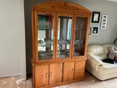 Solid oak dining room table and  china cabinet, View more