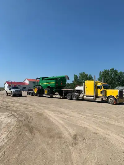 Owner operator Hydraulic RGN trailer with pullouts to 15’ Pilot truck service available Excellent an...