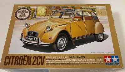 brand new Tamiya 1/24 Citroen 2CV model. The kit is still sealed inside and never started. Features...