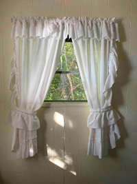 Sets of “Priscilla” curtains