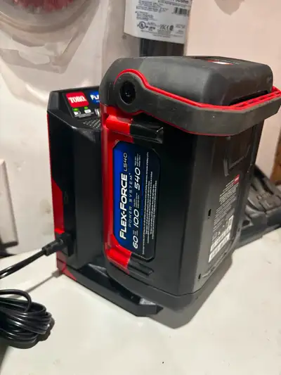 Toro 60V 10 amp battery and charger. New. $475
