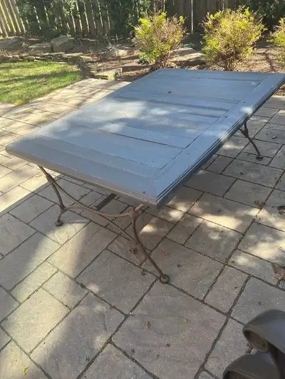MOVING SALE Beautiful wrought iron frame with wood top coffee table, the base of the table is solid...