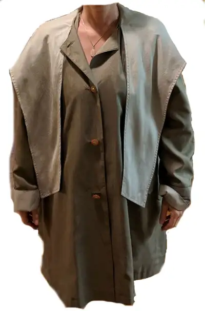 Overcoat in light grey by Thunder Bay. Coat is fully lined. Fabric is iridescent with edging detail...