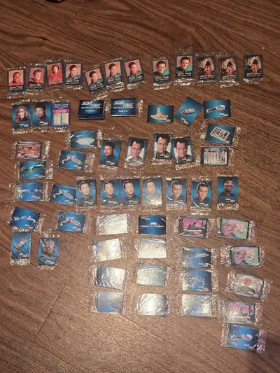 over 50 cards most are in original packaging set not complete