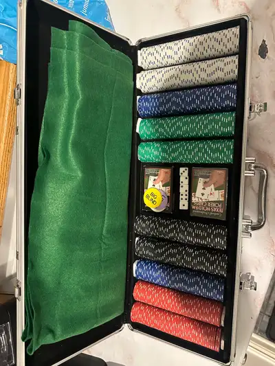 Mint condition barely used poker set. 500 weighted chips. Good for any Texas hold em, poker or home...
