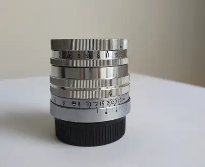 If ad is up it's available Minolta Super Rokkor 5cm f2 screw L39 mount camera lens made of brass. Th...