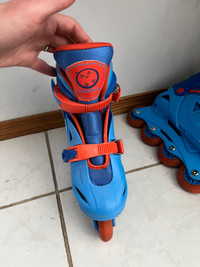 Blue roller blades that grow with your child 