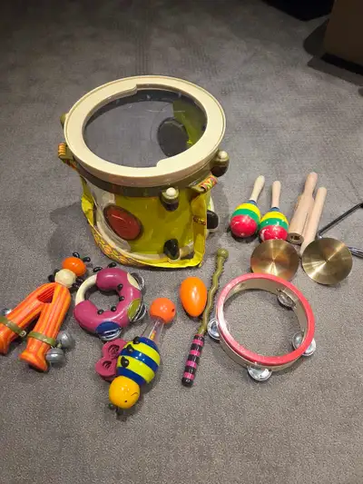 For sale B Toys and Melissa and Doug Musical Instruments. One drum stick is missing, and the clacker...