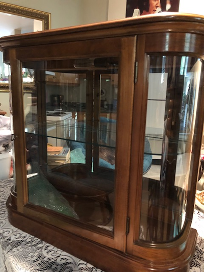 Very good condition glass/Wood Cabinet. Mirror inside Glass Shelf. Light inside. Rounded corners. sm...