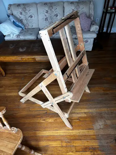 This wooden easel is perfect for artists of all levels, providing a sturdy and adjustable support fo...