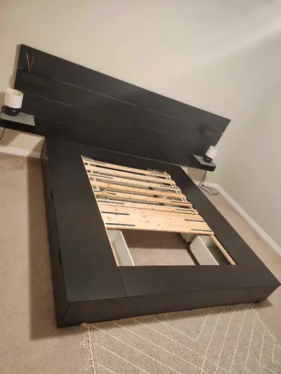 This is an IKEA Malm bed frame in good condition, offering a stylish and functional addition to any...