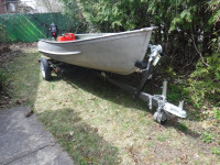 Al boat with outboard and trailer