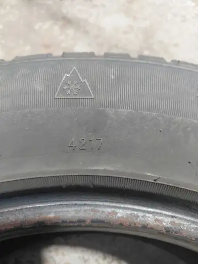 Two used Dodge Caravan tires, size 215/70/16, in reasonable condition.