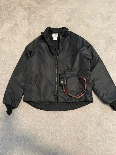 Black Jack heated jacket complete with two controllers. Mens 44. Heated jackets fit tight to ensure...