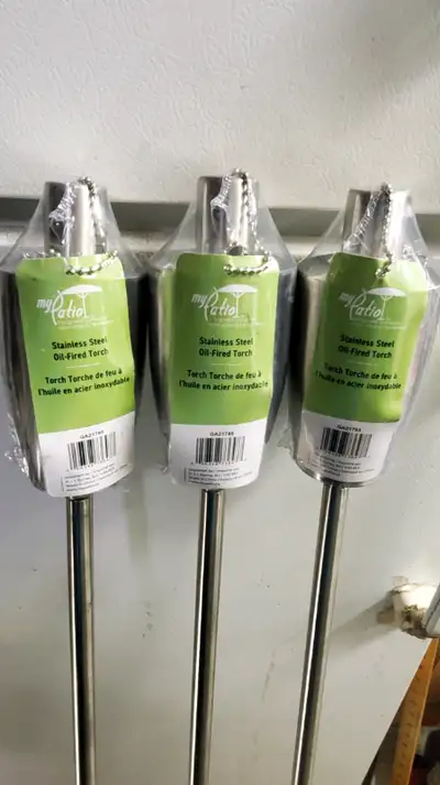 These are 3 NEW stainless steel oil fired torches 45" long and 5" wide at the top really cool for su...
