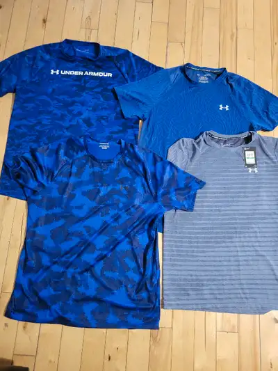 4 mens sz lg Under Armour shirts..one with tags other 3 worn once