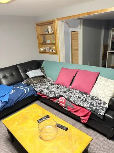 Leon's leather sectional pullout couch. Peeling on cushions. If covered makes a great couch. Structu...